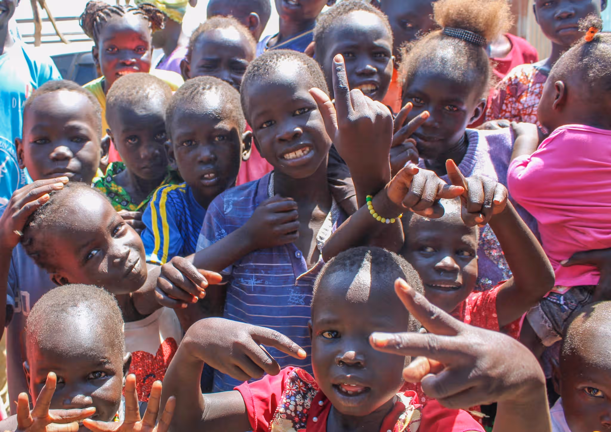 Photograph illustrating EMERGE's "Orphaned and vulnerable young people" response for children at risk